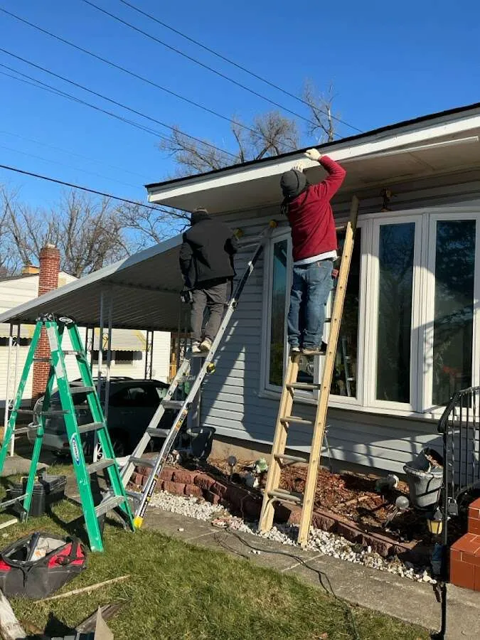 Restoration crew performing exterior repair in Tecumseh